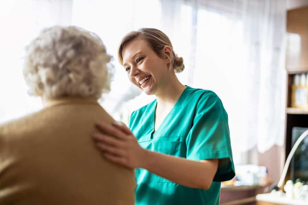 A doctor spending more time with a patient, not her laptop, thanks to iMedat's medical transcription services.