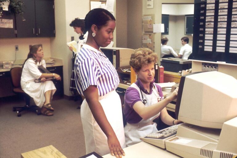 Medical office in the 1980s when computers started to replace typewriters.
