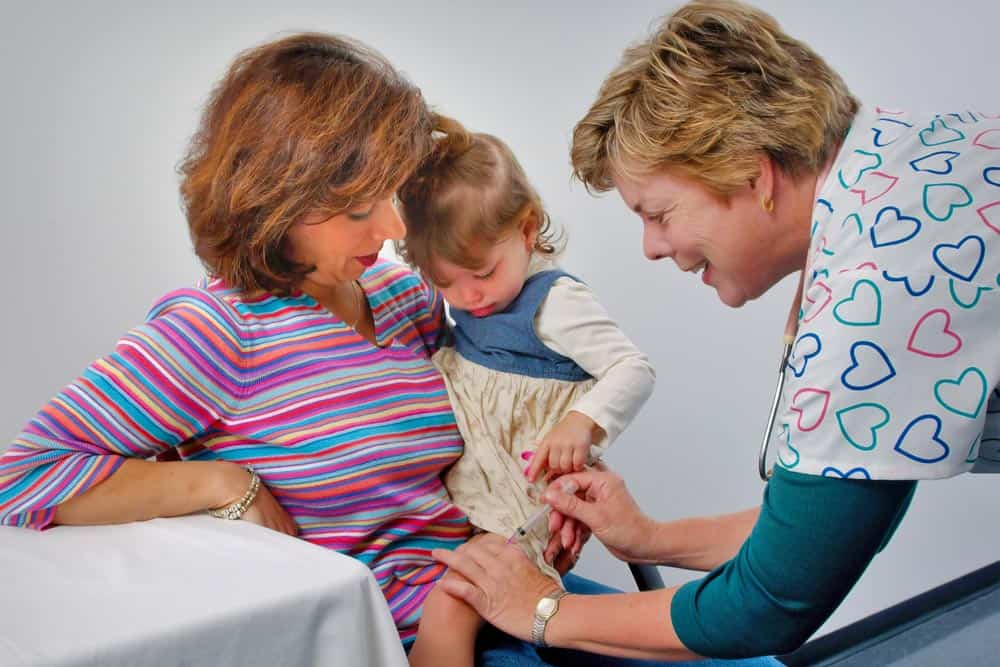 Doctor talking with patient and mother. medical transcription frees up the doctor's attention so that they can provide better patient care rather than concentrate on data entry.