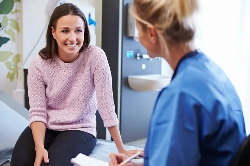 Doctor and patient having one-on-one personal conversation.