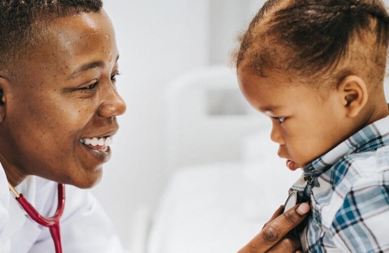 Doctor listening to a toddler's heart